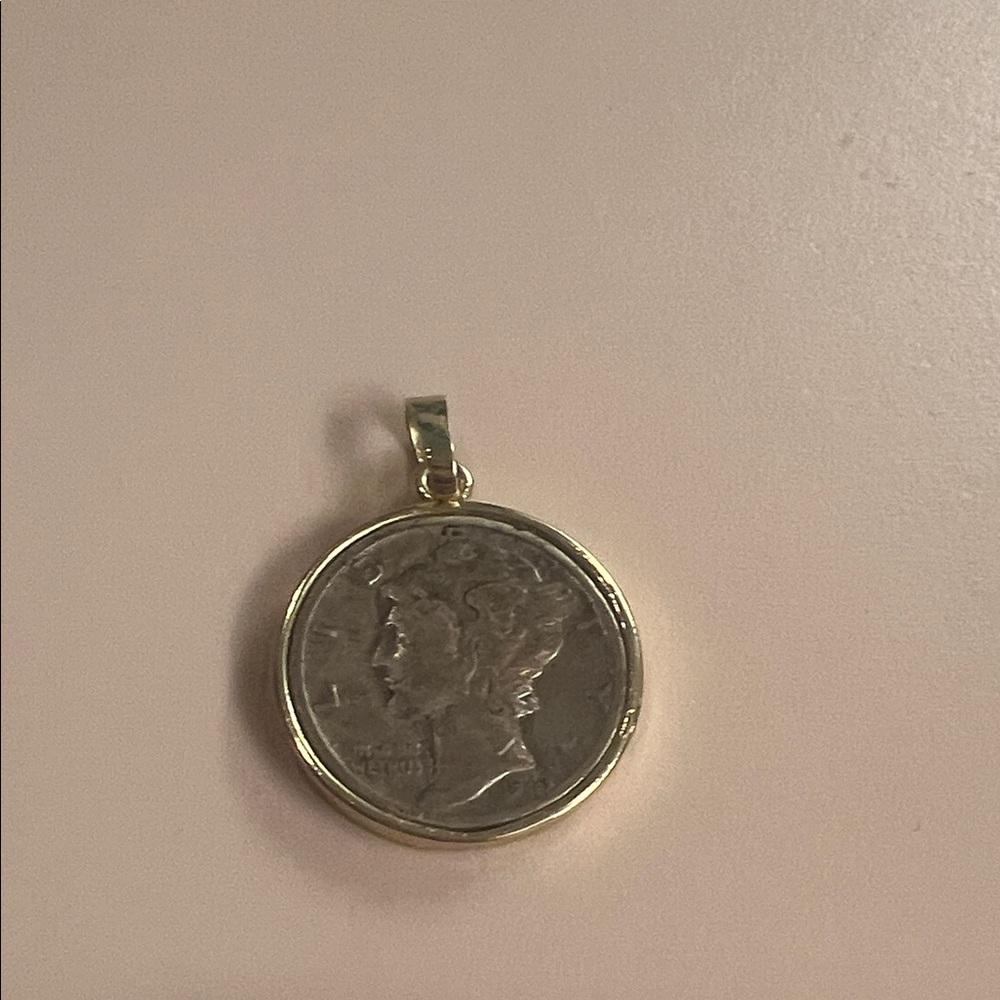 Gold and Silver Coin Pendant. So pretty and shows sophistication.
